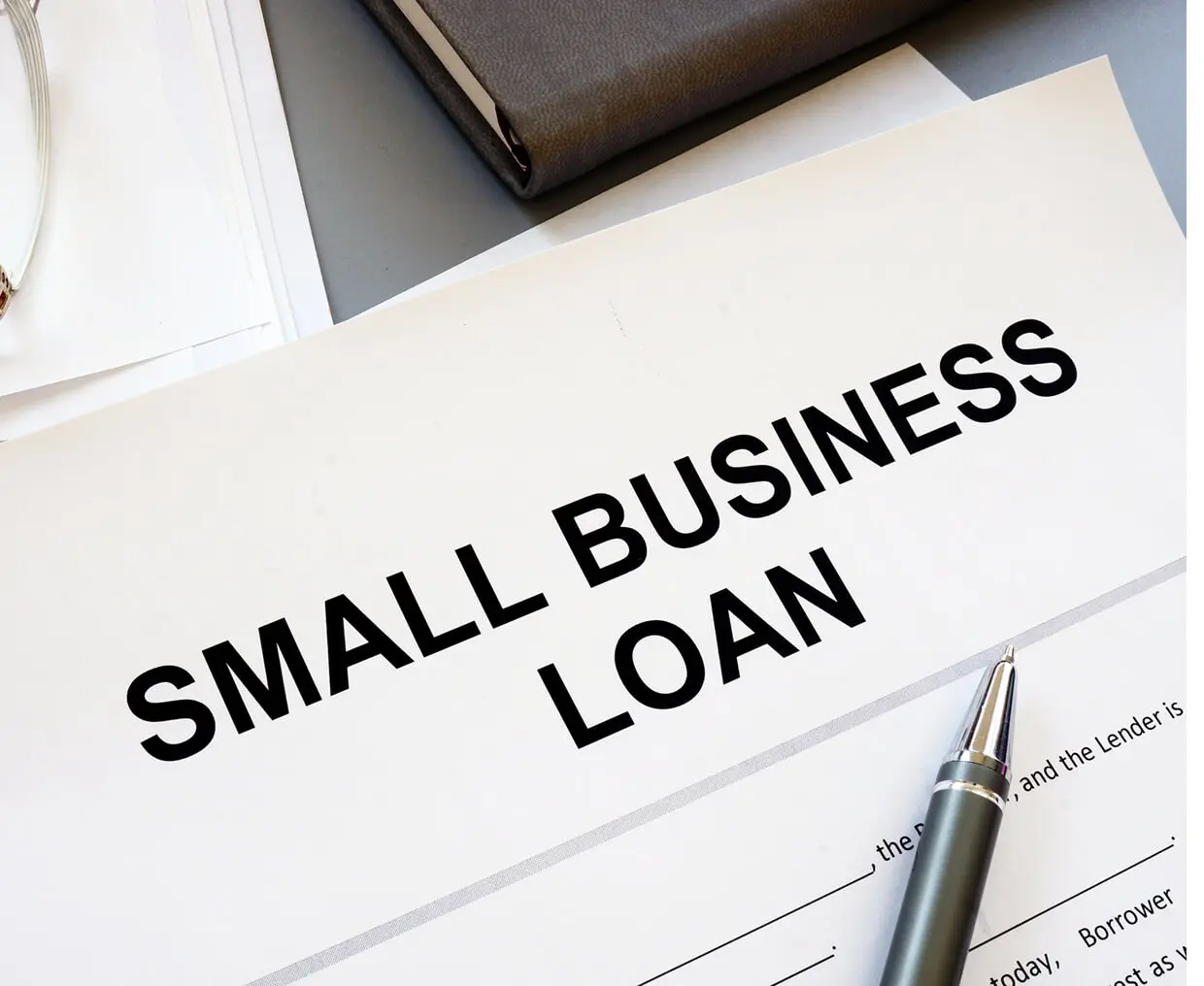 Small business loan document and pen.